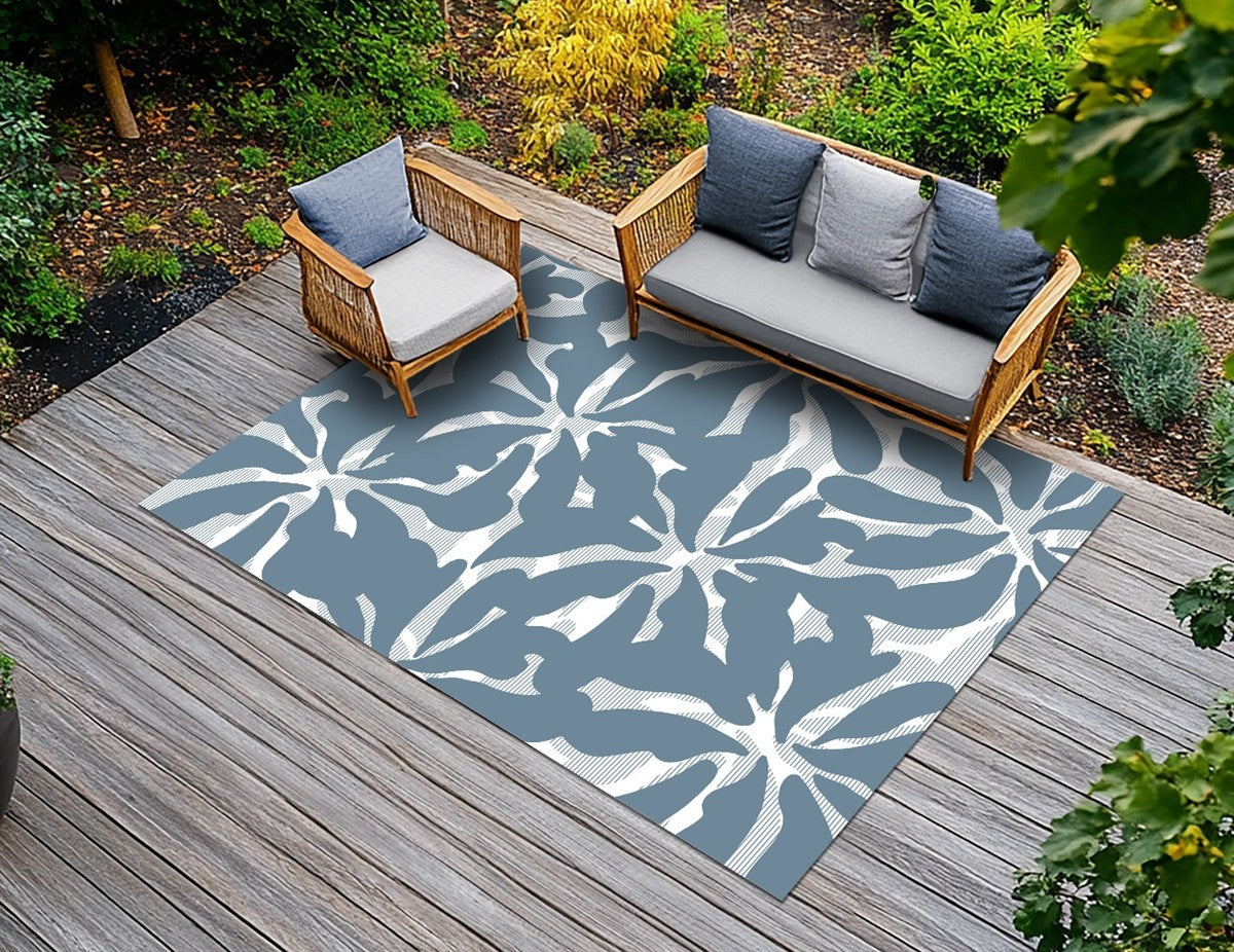 Archive green leaf outdoor rug in an outdoor seating space